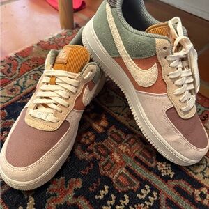 Nike Air Force 1 Low in Cream, Orange, and Green